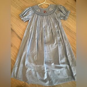 Blue and white football smocked dress by Rosalina